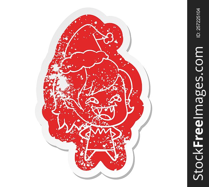 Cartoon Distressed Sticker Of A Laughing Vampire Girl Wearing Santa Hat