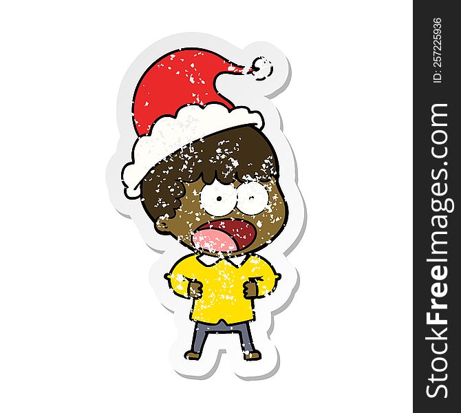 distressed sticker cartoon of a shocked man wearing santa hat