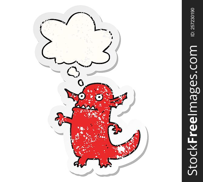 cartoon halloween monster with thought bubble as a distressed worn sticker