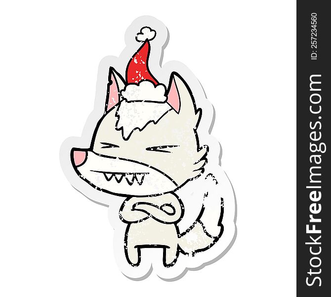 Angry Wolf Distressed Sticker Cartoon Of A Wearing Santa Hat