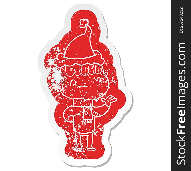 quirky cartoon distressed sticker of a friendly boy wearing santa hat