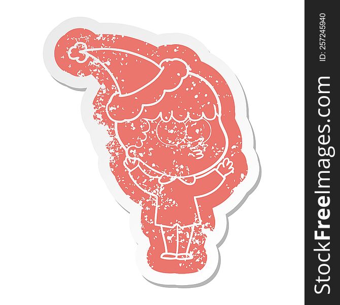 cartoon distressed sticker of a curious boy wearing santa hat