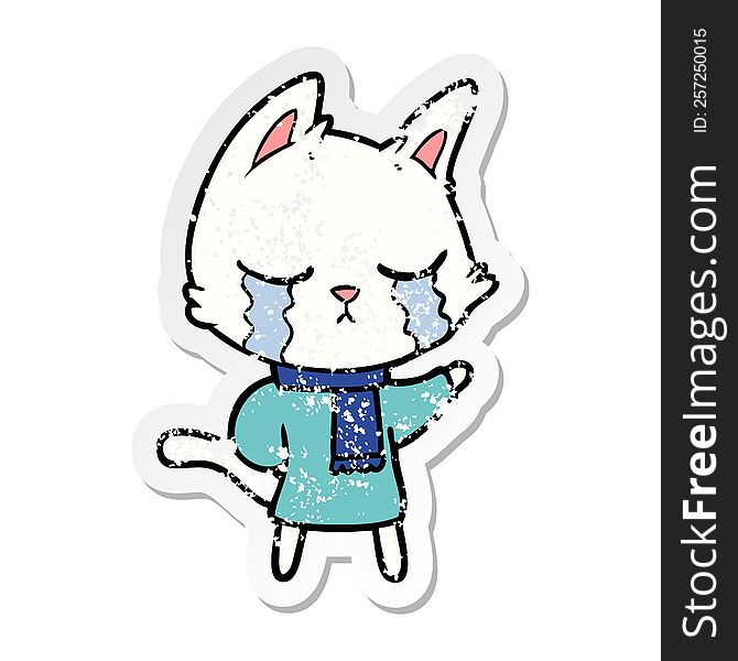 Distressed Sticker Of A Crying Cartoon Cat Wearing Winter Clothes