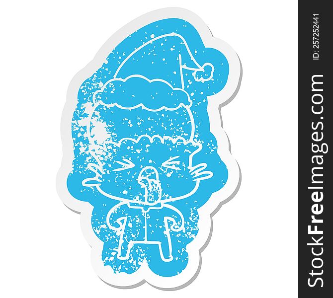 Weird Cartoon Distressed Sticker Of A Alien Wearing Santa Hat