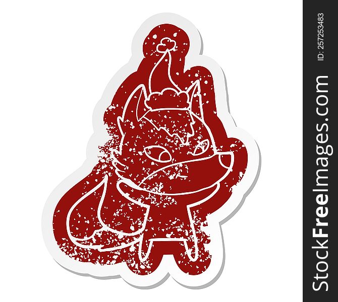 Friendly Cartoon Distressed Sticker Of A Wolf Wearing Santa Hat