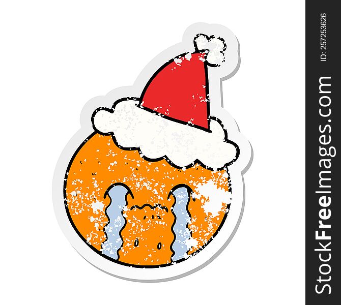 Distressed Sticker Cartoon Of A Orange Wearing Santa Hat