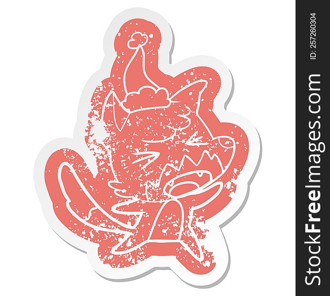 Angry Cartoon Distressed Sticker Of A Fox Wearing Santa Hat