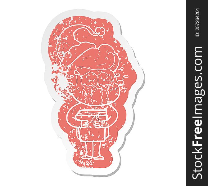 quirky cartoon distressed sticker of a crying man holding book wearing santa hat