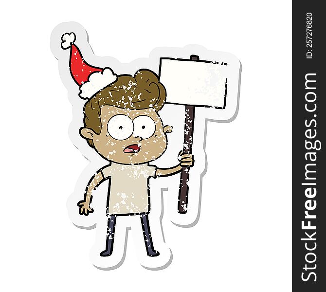 hand drawn distressed sticker cartoon of a staring man wearing santa hat