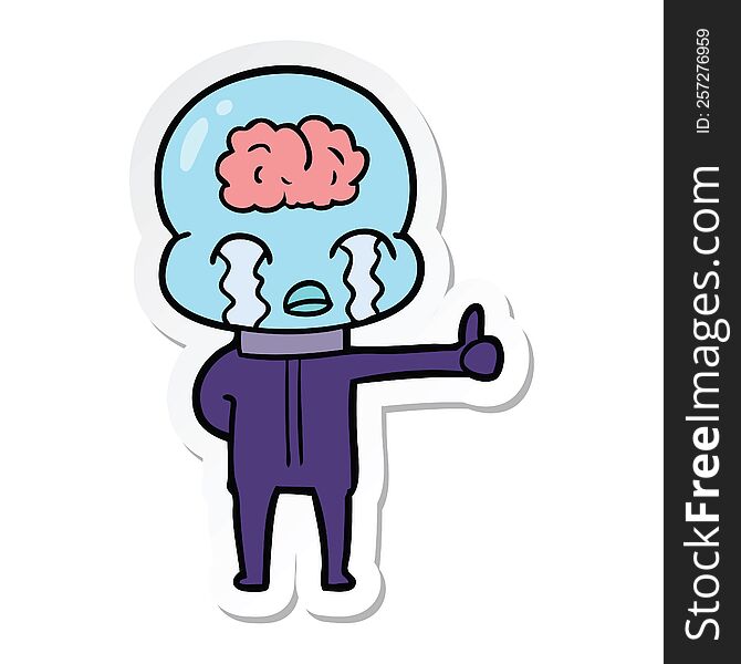 Sticker Of A Cartoon Big Brain Alien Crying But Giving Thumbs Up Symbol