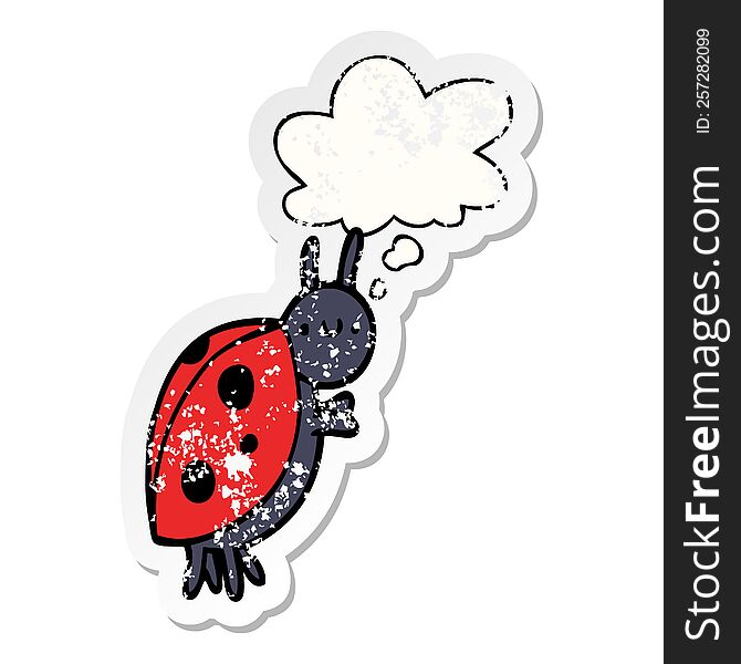 cartoon ladybug with thought bubble as a distressed worn sticker