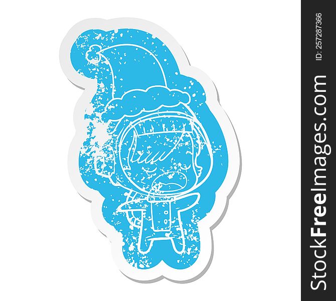 Cartoon Distressed Sticker Of A Talking Astronaut Woman Wearing Santa Hat