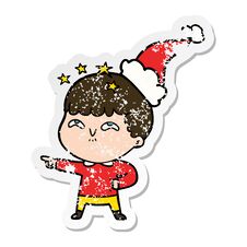 Distressed Sticker Cartoon Of A Amazed Boy Wearing Santa Hat Stock Photo