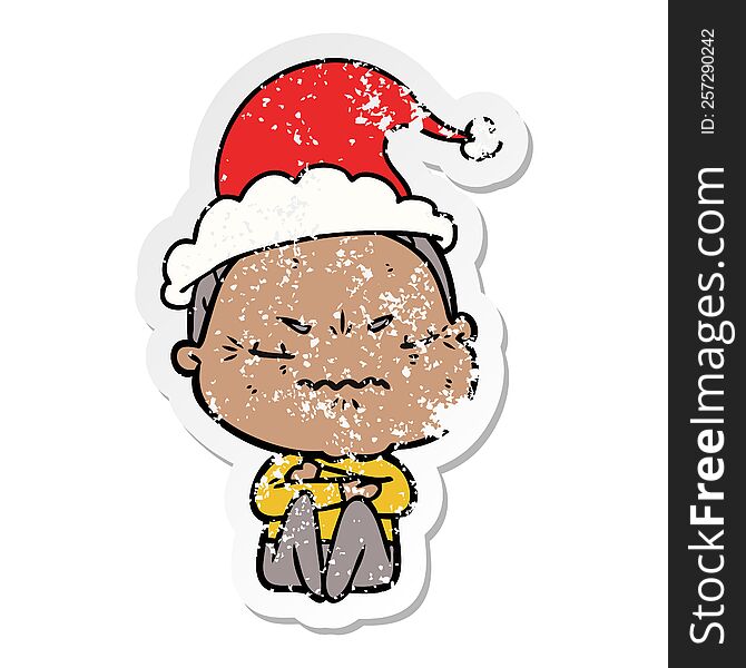 hand drawn distressed sticker cartoon of a annoyed old lady wearing santa hat