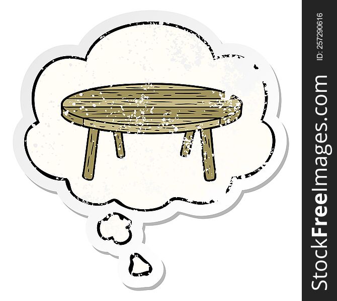 cartoon table with thought bubble as a distressed worn sticker