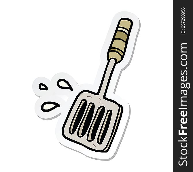 sticker of a cartoon kitchen spatula