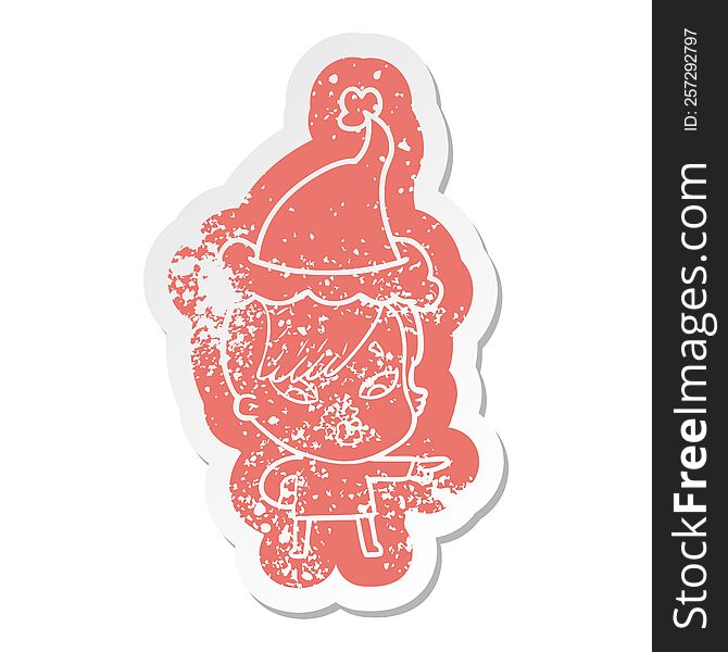 Cartoon Distressed Sticker Of A Surprised Girl Pointing Wearing Santa Hat