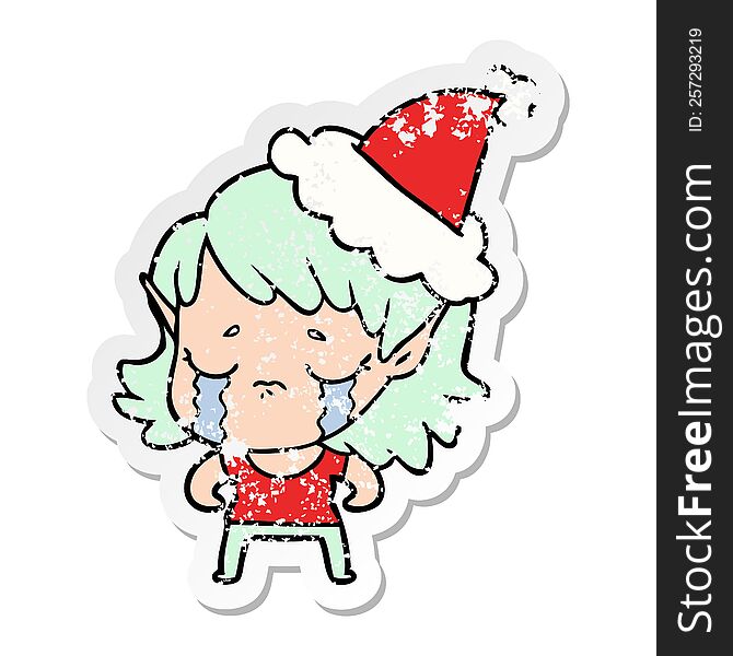 Distressed Sticker Cartoon Of A Crying Elf Girl Wearing Santa Hat