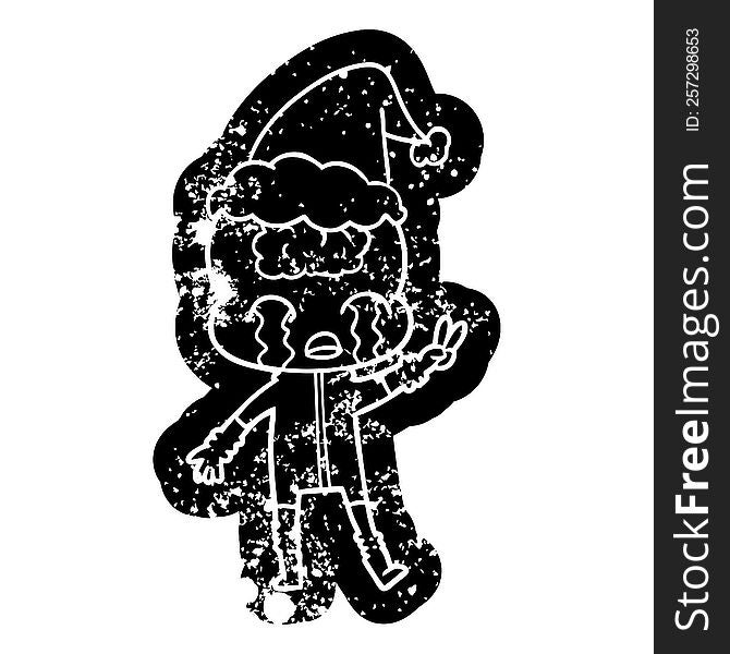 quirky cartoon distressed icon of a big brain alien crying and giving peace sign wearing santa hat