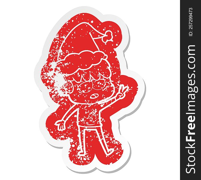 Cartoon Distressed Sticker Of A Exhausted Boy Wearing Santa Hat