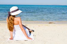 Young Woman Sitting On The Beach Royalty Free Stock Images Young Woman Sitting On The Beach Royalty Free Stock Images