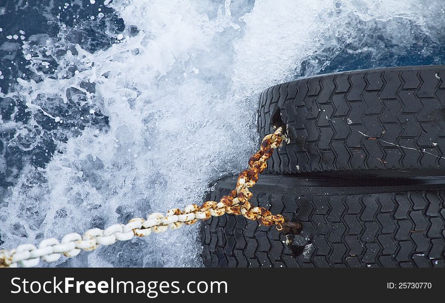 Water surface with splashing waves and boat equipment