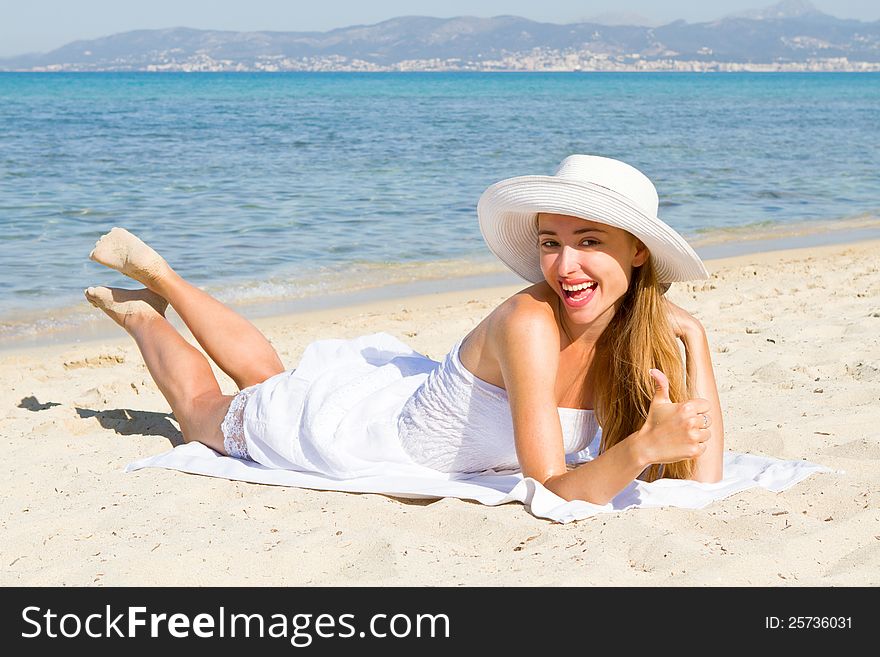 Happy Young Beautiful Woman  On The Beach