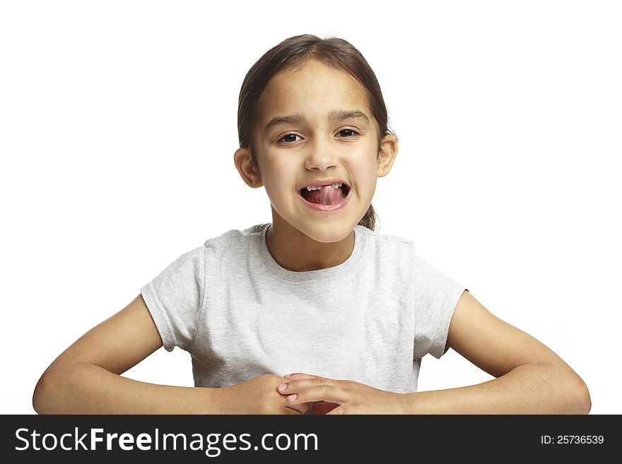 Young girl with missing front tooth on white background