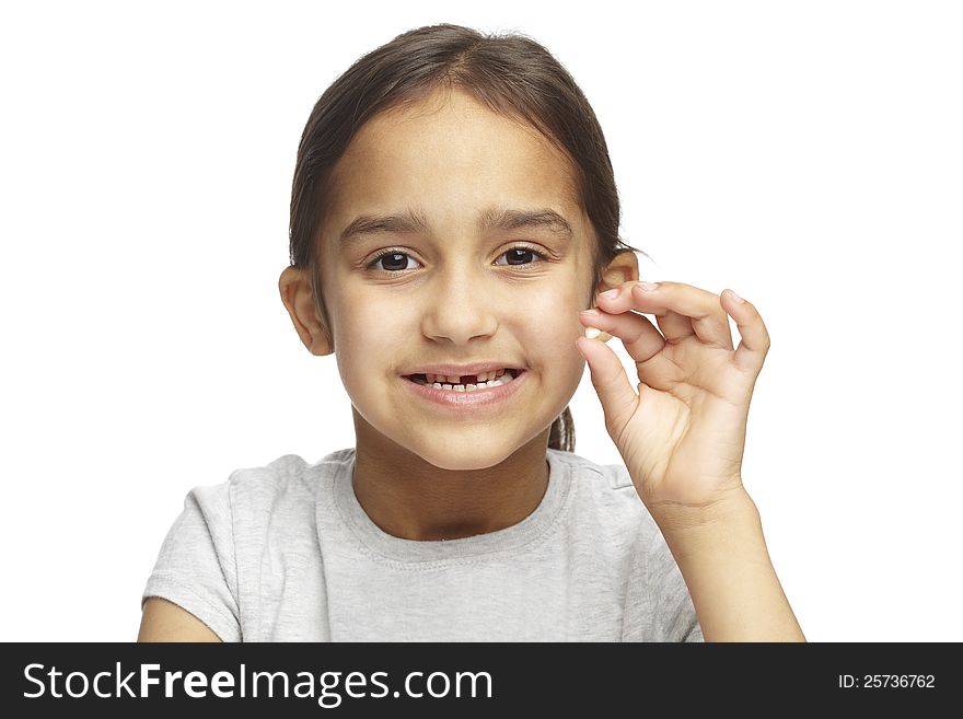 Young girl with missing front tooth on white background