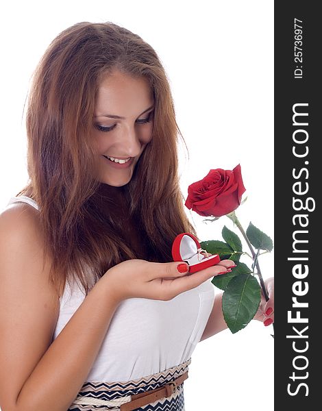 Girl was presented with a red rose and a box with a ring. Girl was presented with a red rose and a box with a ring