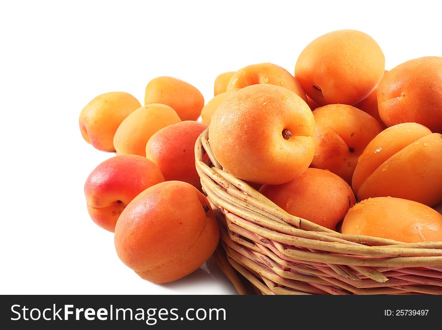 Ripe apricots in a wicker basket