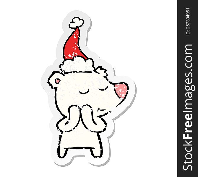 happy hand drawn distressed sticker cartoon of a polar bear wearing santa hat