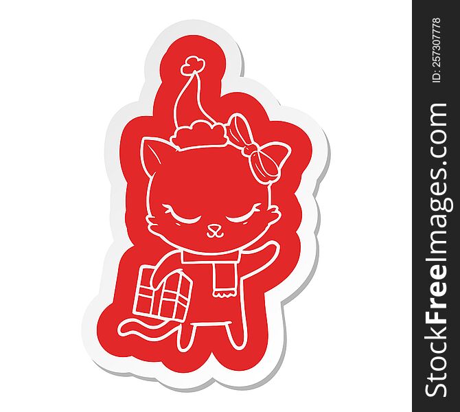 cute cartoon  sticker of a cat with present wearing santa hat