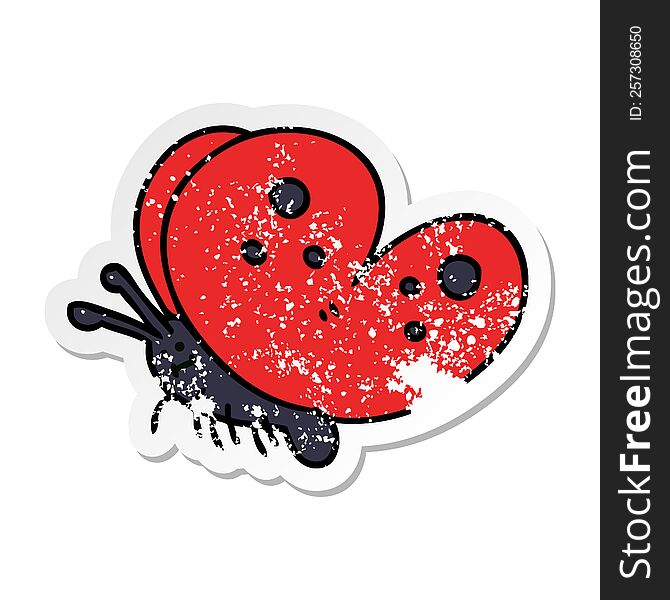 distressed sticker of a quirky hand drawn cartoon butterfly