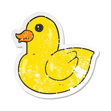 Retro Distressed Sticker Of A Cartoon Rubber Duck Royalty Free Stock Images