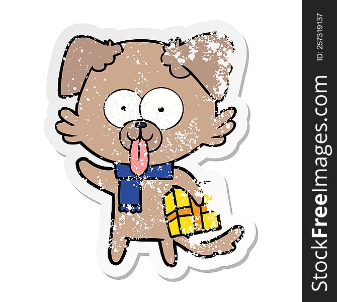Distressed Sticker Of A Cartoon Dog With Christmas Present