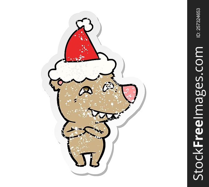 Distressed Sticker Cartoon Of A Bear Showing Teeth Wearing Santa Hat