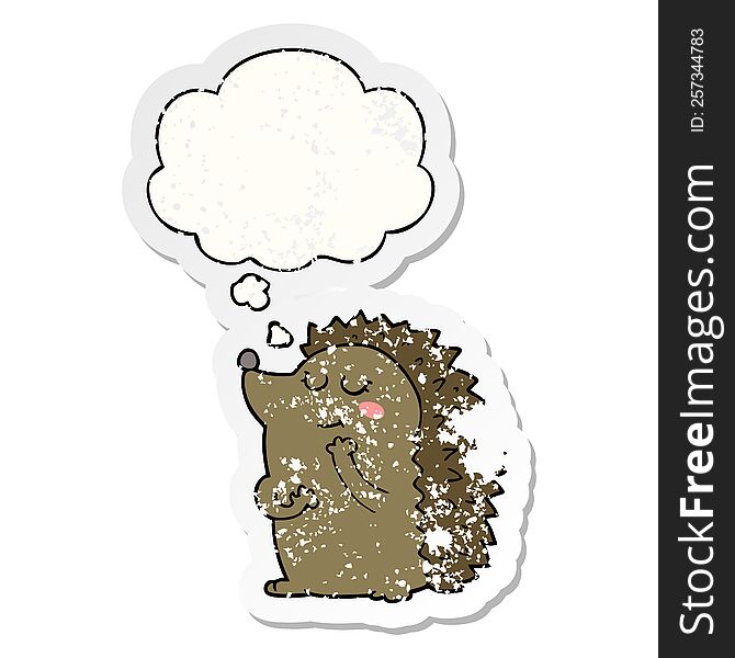cute cartoon hedgehog with thought bubble as a distressed worn sticker