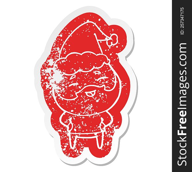 Cartoon Distressed Sticker Of A Happy Bearded Man Wearing Santa Hat