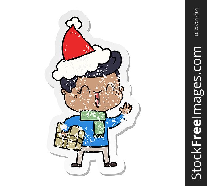 hand drawn distressed sticker cartoon of a laughing boy wearing santa hat