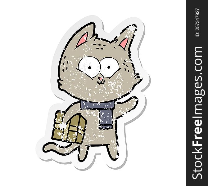 distressed sticker of a cartoon cat holding christmas present