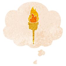 Cartoon Flaming Torch And Thought Bubble In Retro Textured Style Royalty Free Stock Photos
