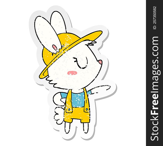 distressed sticker of a cartoon rabbit construction worker