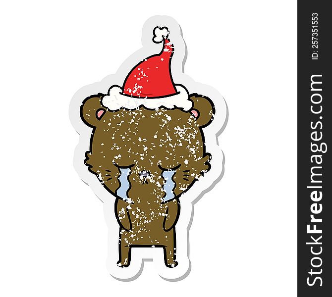 crying hand drawn distressed sticker cartoon of a bear wearing santa hat. crying hand drawn distressed sticker cartoon of a bear wearing santa hat
