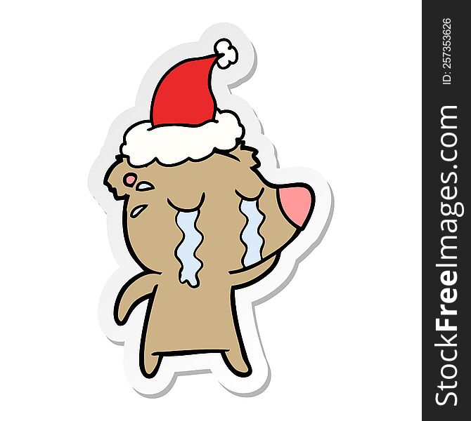 Sticker Cartoon Of A Crying Bear Wearing Santa Hat