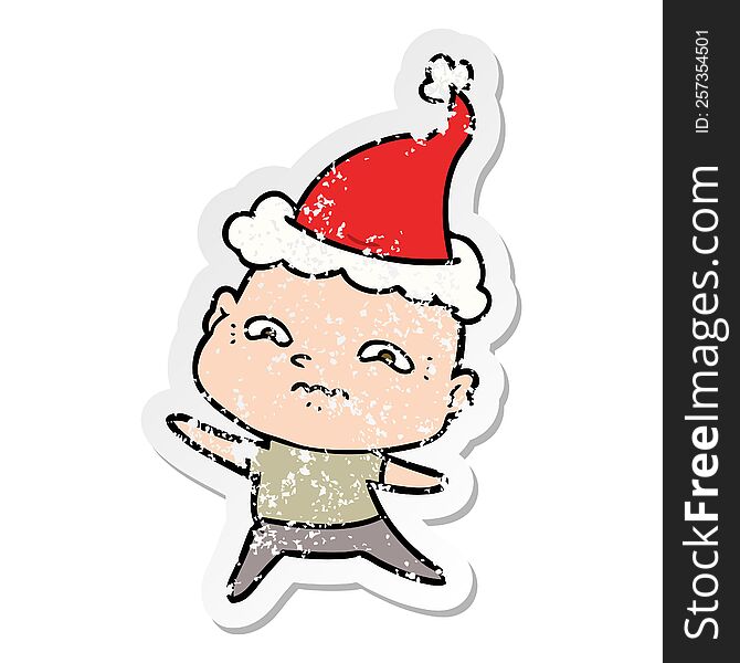 Distressed Sticker Cartoon Of A Nervous Man Wearing Santa Hat