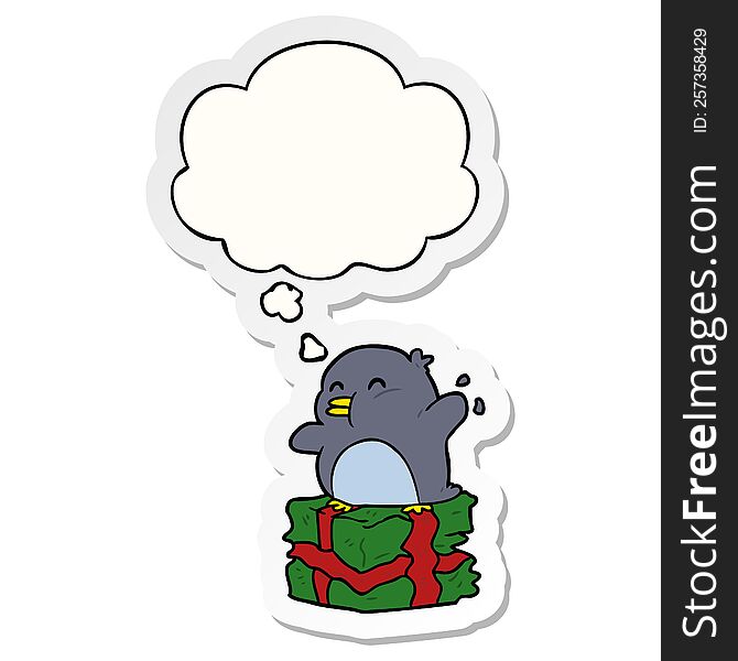Cartoon Penguin On Present And Thought Bubble As A Printed Sticker