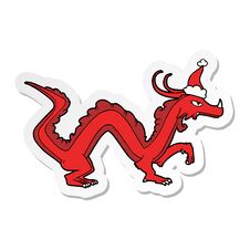 Sticker Cartoon Of A Dragon Wearing Santa Hat Stock Photo