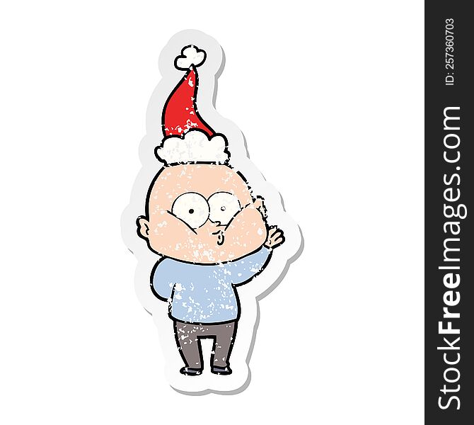 Distressed Sticker Cartoon Of A Bald Man Staring Wearing Santa Hat