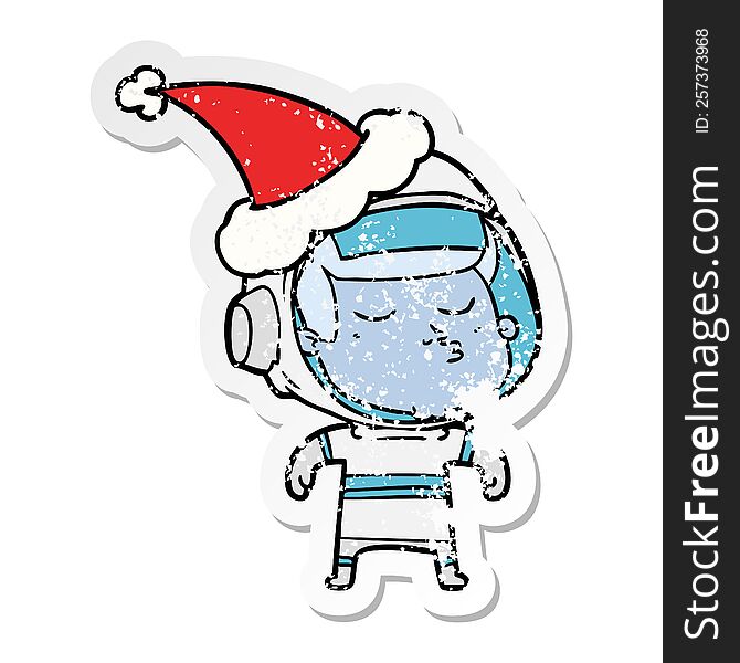 Distressed Sticker Cartoon Of A Confident Astronaut Wearing Santa Hat
